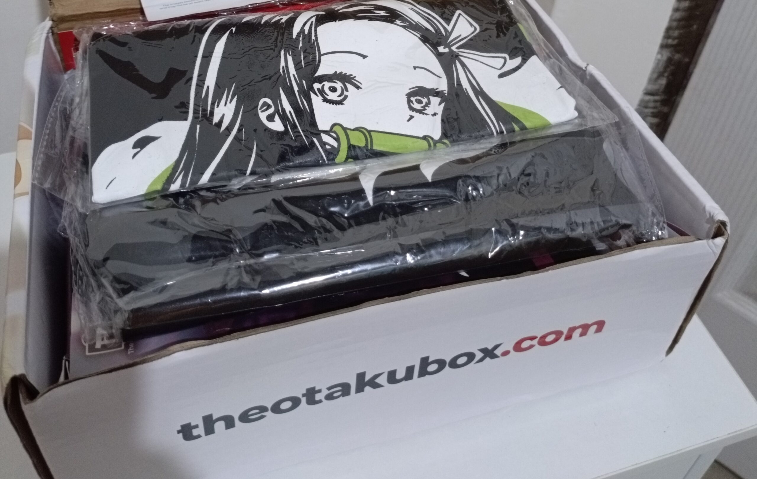 The Otaku Box May 2024 Nezuko Shirt scaled April 2024 Otaku Box Unboxing: Monster Maids, Fierce Slayers, and Everything in Between!